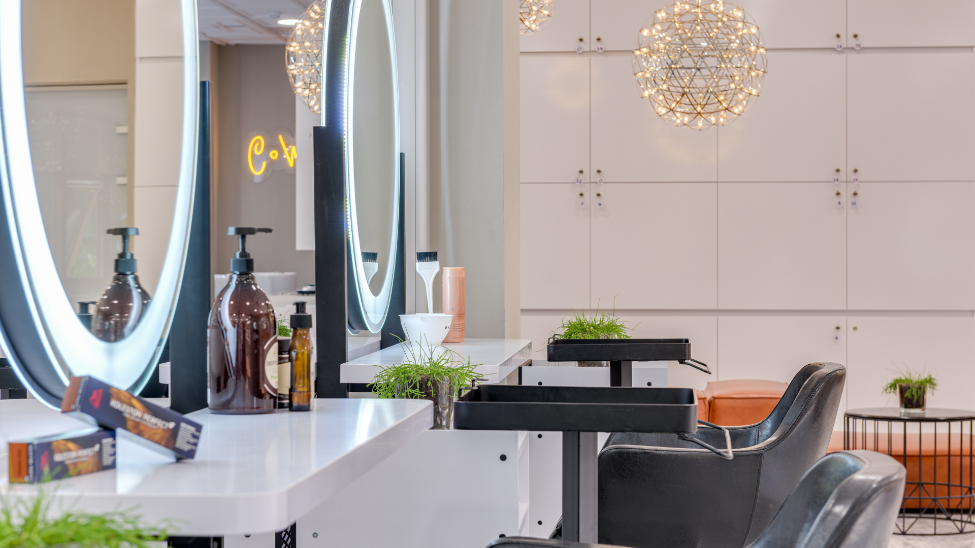 empty salon with two empty chairs and mirrors