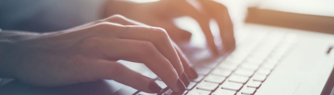 Person typing on a computer