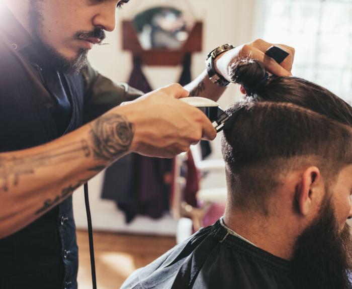 Barber cutting a man's hair