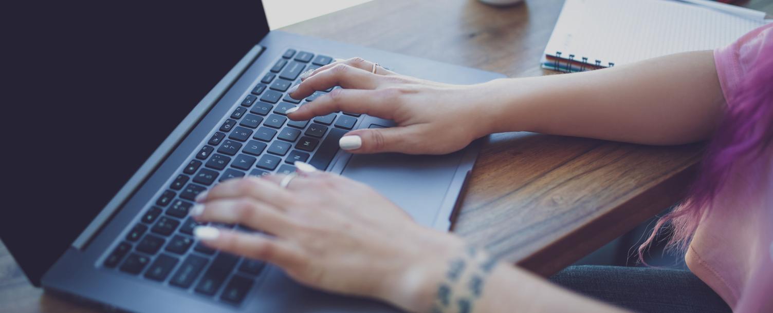 Someone typing on a computer